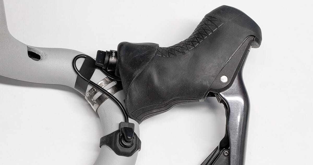 Shifter wire taped to handlebar