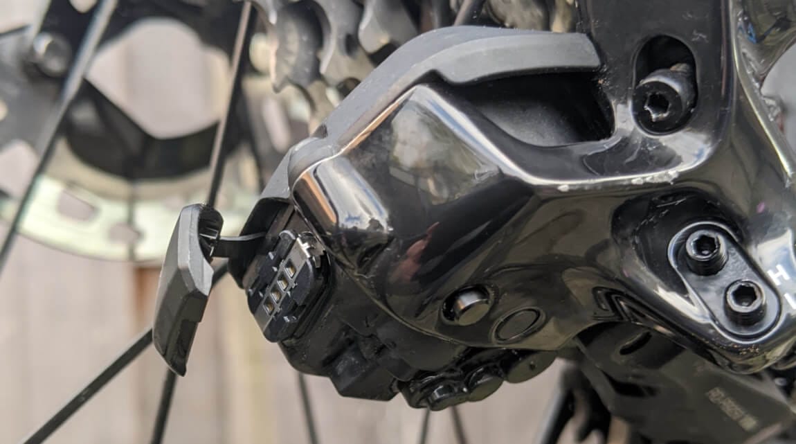 Derailleur charge port cover